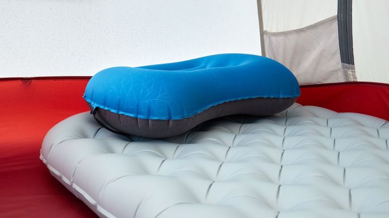 Inflatable sleeping pad and camp pillow